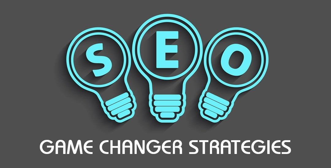 Image of blue lightbulbs saying SEO and a brownish background. Game changing strategies for Search Engine Optimization.
